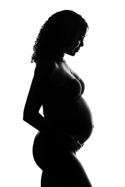Pregnant woman in soft daylight